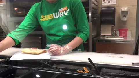 The motion of worker preparing a sandwich for the customer Stock Footage 278578444