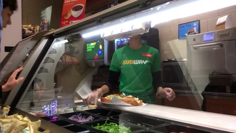 The motion of worker preparing a sandwich for the customer Video stock 278579027
