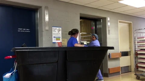 Motion of worker pushing garbage can and taking staff use only elevators Stock Footage 68185261