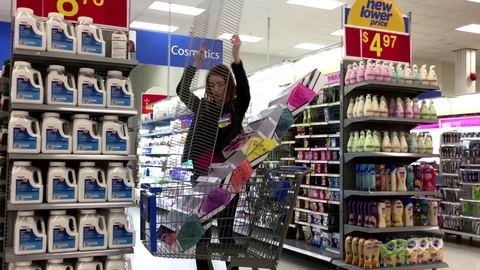 Motion of worker removing display rack inside Walmart store Stock Footage 72971947