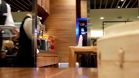 Motion of worker serving foods for customer inside restaurant Stock Footage 84621405