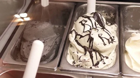 Motion of worker serving ice cream for customer inside shopping mall Stock Footage 82549463