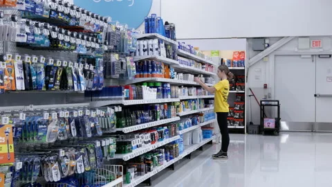 Motion of worker stocking band aid at medical supplies section Stock Footage 118253124