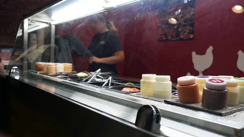 Motion of worker taking order by customer buying hamburger Stock Footage 80518100