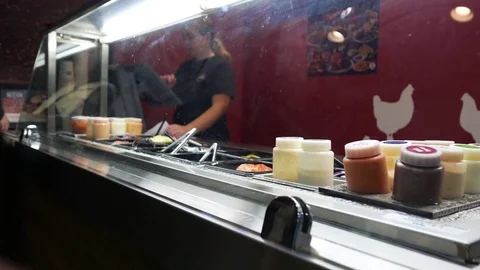 Motion of worker taking order by customer buying hamburger Stock Footage