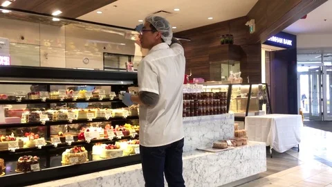 Motion of worker taking picture for display birthday cake 스톡 동영상 83019542