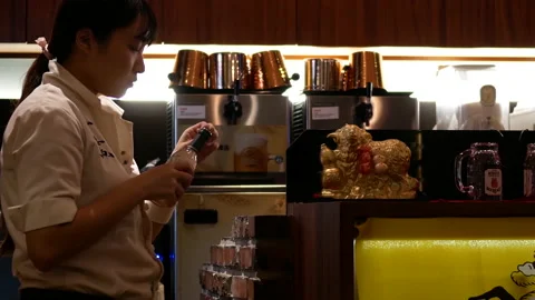 Motion of worker tearing package of drink table and putting inside fridge Stock Footage 96791095
