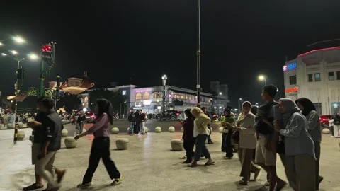 Motionlapse of Tourists at Kilometer Zero Yogyakarta During Night with Historic Stock-Footage 340156005