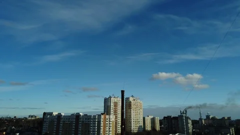 Motionlapse of view on a blue sky. Small clouds floating in the daily sky over t Видео 122328606