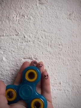 Motionless Fidget Spinner in Hand Stock Photos