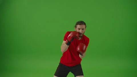 Motivated Bearded Boxer Standing in Front of Camera and Making Boxing Exercises Video stock 220470409