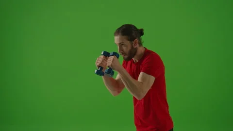 Motivated Bearded Fighter Doing Boxing Exercises while Wearing Red Sportswear Stock Footage 220468984