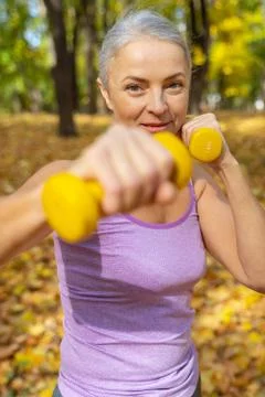Motivated lady doing an upper back exercise Stock-Fotos