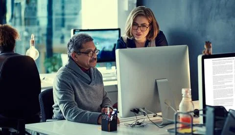 Motivated to make it through all their tasks. a group of businesspeople working Foto stock