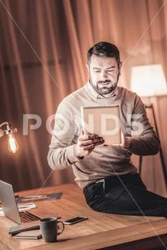 Motivated man using social media Stock Photos