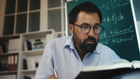Motivated middle-aged man working on scientific research, focused on mathematics Stock Footage 311461946
