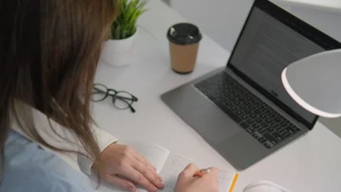 A motivated student dedicated to their studies excels in online learning, using Stock-Footage 317025339