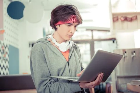 Motivated teen learning programming languages with online app Stock Photos