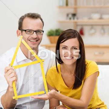 Motivated young couple planning for a home Stock Photos