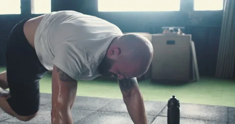 Motivation concept. Close-up strong hands of muscular man working out alone with Stock Footage 148382612