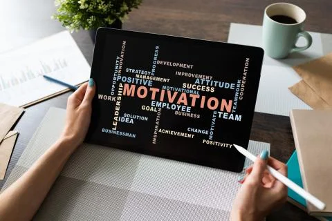 Motivation words cloud on the device screen. Fotos Stock