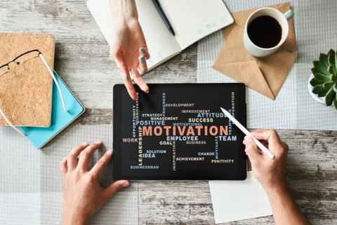 Motivation words cloud on the device screen. Stock-Fotos