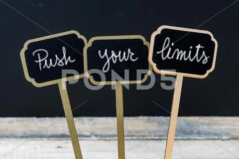 Motivational message Push Your Limits written with chalk Stock Photos