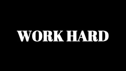 Motivational quote work hard written in bold white serif font on a solid black Stock Footage 337465367