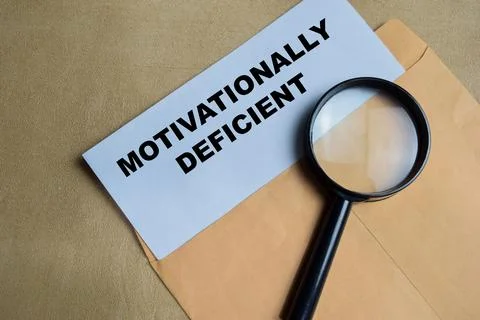Motivationally deficient text on document above brown envelope. Stock Photos