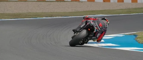 Moto 2 Taking a Fast Turn Stock Footage 312866489