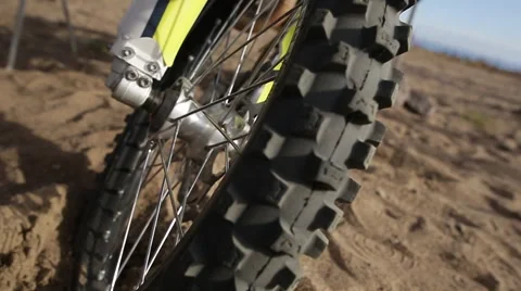 Moto type wheel marco on beach 50 p Stock Footage 68566251