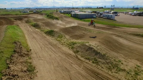 Motocross rider performs rhythm section of race track Video stock 50769486