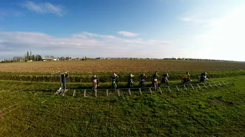 Motocross start under flying multirotor Stock Footage 52440161