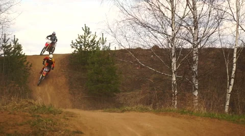 Motocross Training in nature. Jump on the platform Stock Footage 63545704