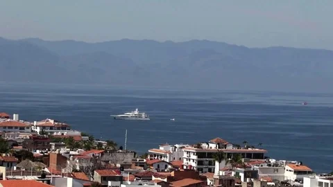 Motor boat approaching bay, 2 jet ski passing Stock Footage 78008771
