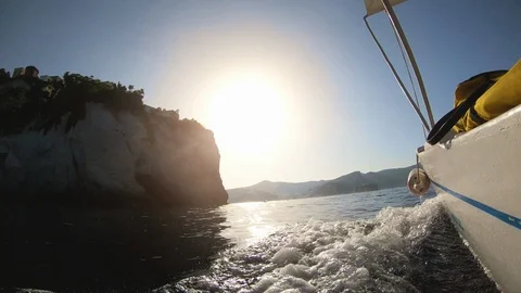 Motor boat breaking waves at sunset in the ocean action cam 스톡 동영상 94959644