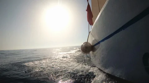 Motor boat breaking waves at sunset in the ocean action cam Stock Footage 100387063