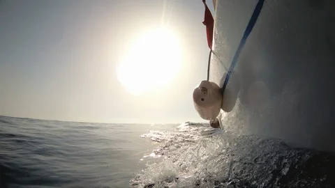 Motor boat breaking waves at sunset in the ocean action cam Stock-Footage 119640354