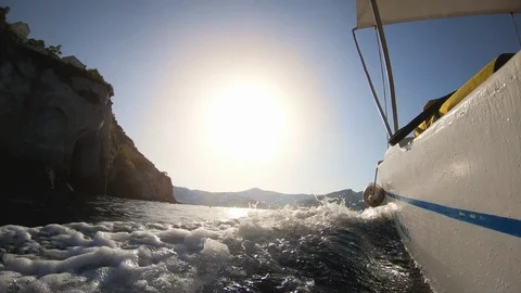 Motor boat breaking waves at sunset in the ocean action cam 스톡 동영상 119640464