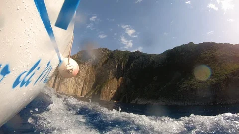 Motor boat breaking waves at sunset in the ocean action cam 스톡 동영상 119640667