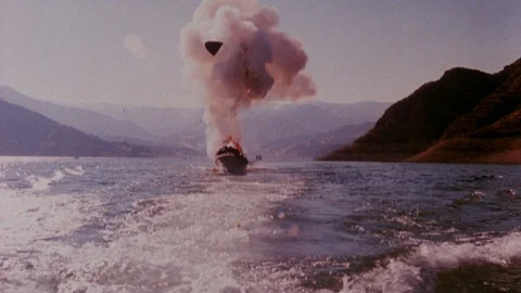 Motor boat on fire after explosion at sea, 1980s Stock Footage 90728001