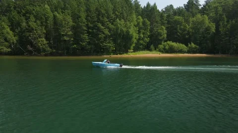 A motor boat is floating on the river Stock Footage 170700021