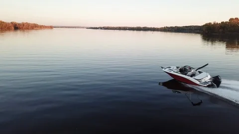 Motor boat floating on the river at sunset Stock Footage 119638145