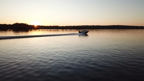 Motor boat floating on the river at sunset Stock Footage 119640103