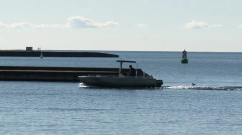 Motor boat in the lee of the breakwater Stock Footage 31820719