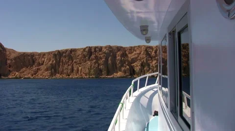 Motor boat POV approaches Rocky Island Stock Footage
