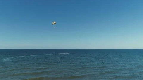 A Motor Boat Pulls A Parachute In The Open Sea Stock Footage 122018976