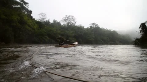 The motor boat pulls a raft on the river against the current Stock Footage 8949020