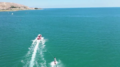 Motor boat pulls a surfer riding the water surface on his board. Stock Footage 202625004