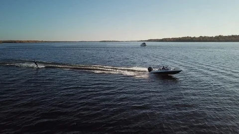 Motor boat pulls a wakeboard Stock Footage 119637226